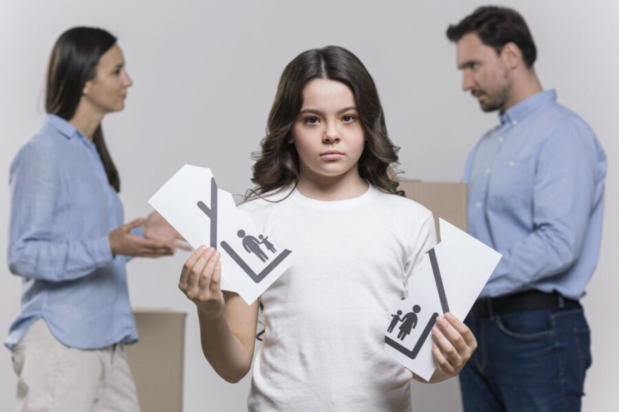 portrait-sad-girl-with-parents-arguing